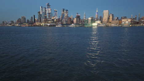 aerial view of midtown manhattan and the hudson river at night