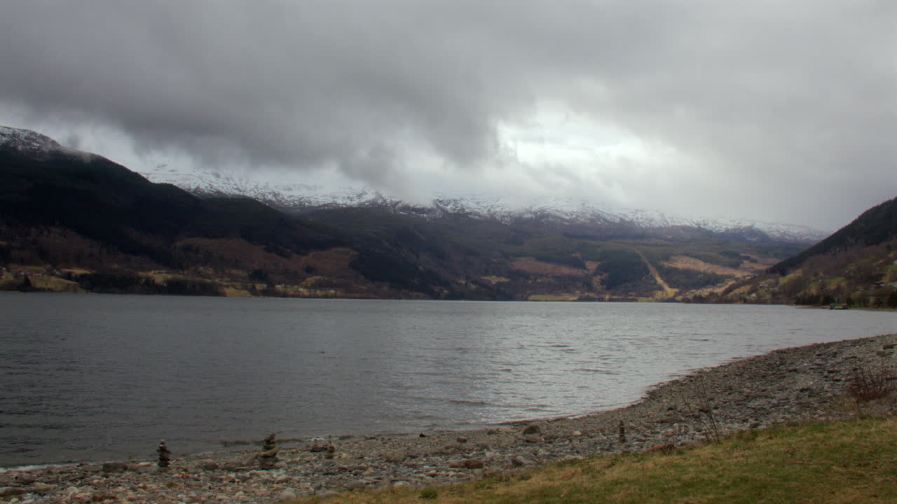 wide shot looking across the Vangsvatnet, Vatnet lake to Tjornahorgi in Vossevangen, voss
