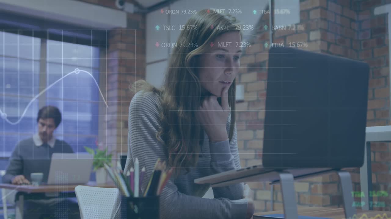 Animation of trading board and graphs over caucasian woman working on laptop at office