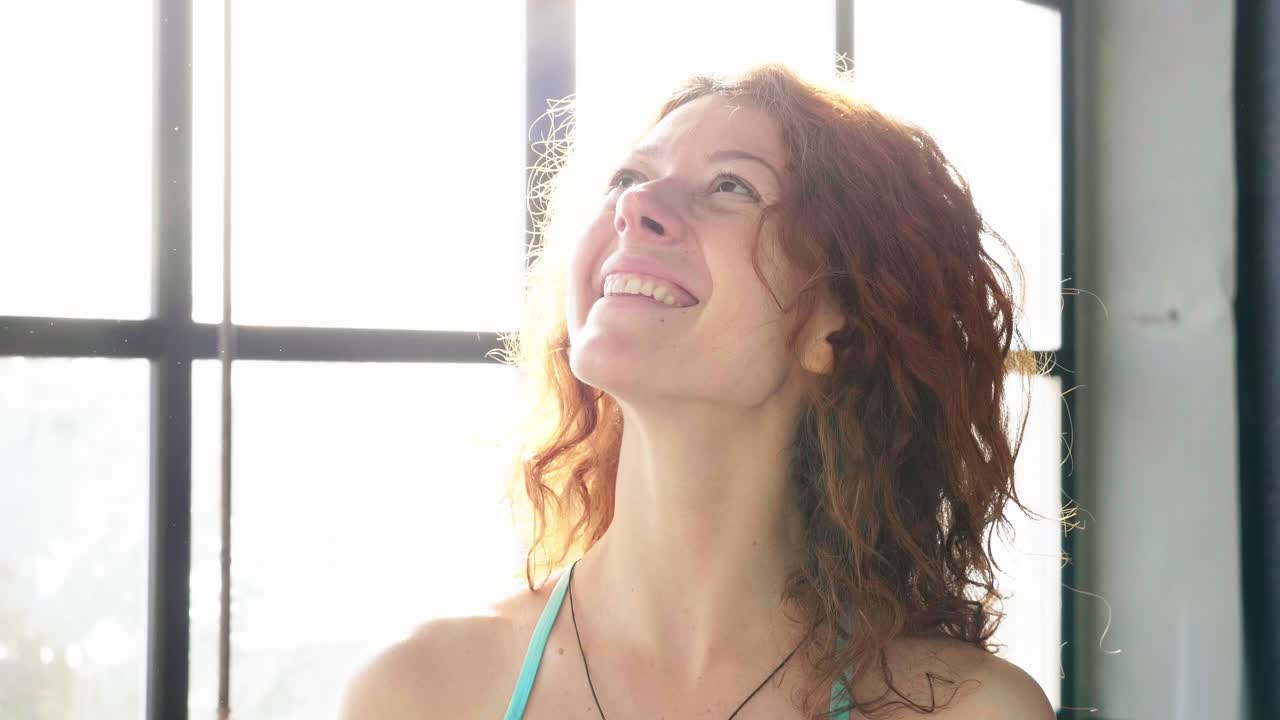 Smiling Woman with Red Curly Hair