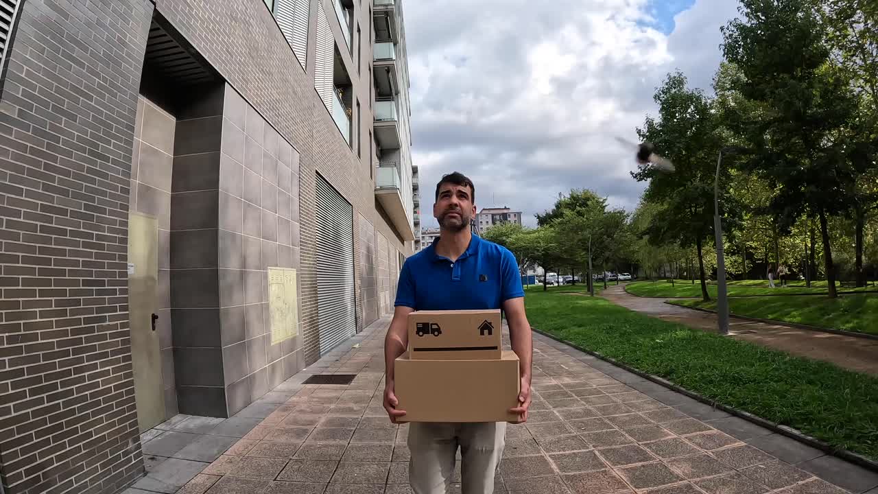 Man Carrying Boxes in the City