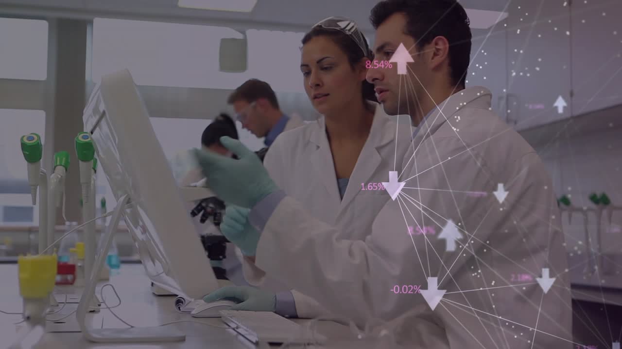 Male tech viewing screen while female tech pointing, leading lab analysis with overlay on right