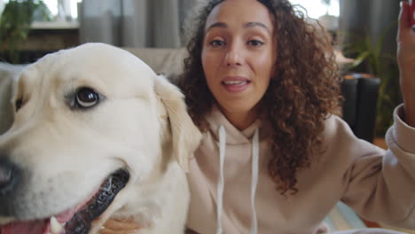 woman taking a selfie with her dog