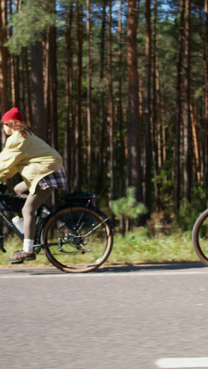 Woman Cycling Through a Forest
