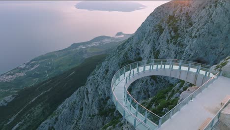 sunset view of the famous skywalk at the top of the biokovo nature park in southern croatia built for sustainable tourism, drone shot