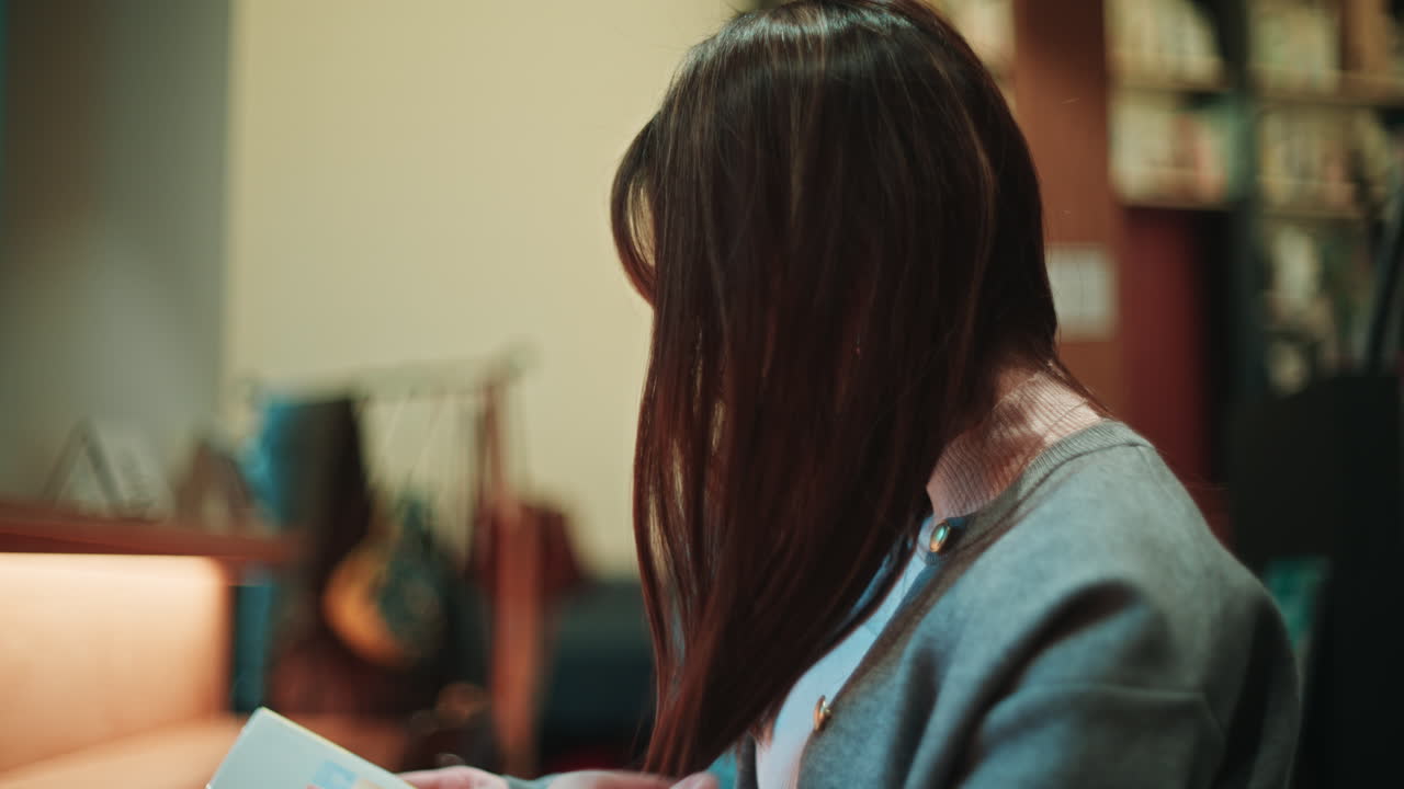 A woman reading in a library