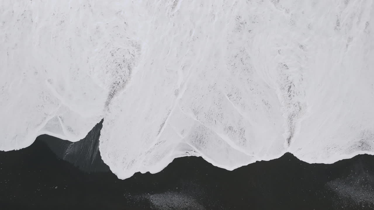 Black Sand Beach with Powerful Waves