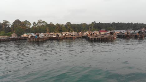 motorboat is cruising near tanjung binga village at belitung indonesia, aerial