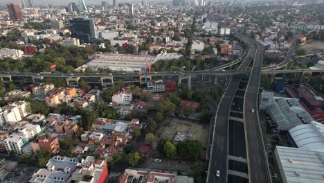 orbital drone shot of aztec pyramid in the middle of mexico city