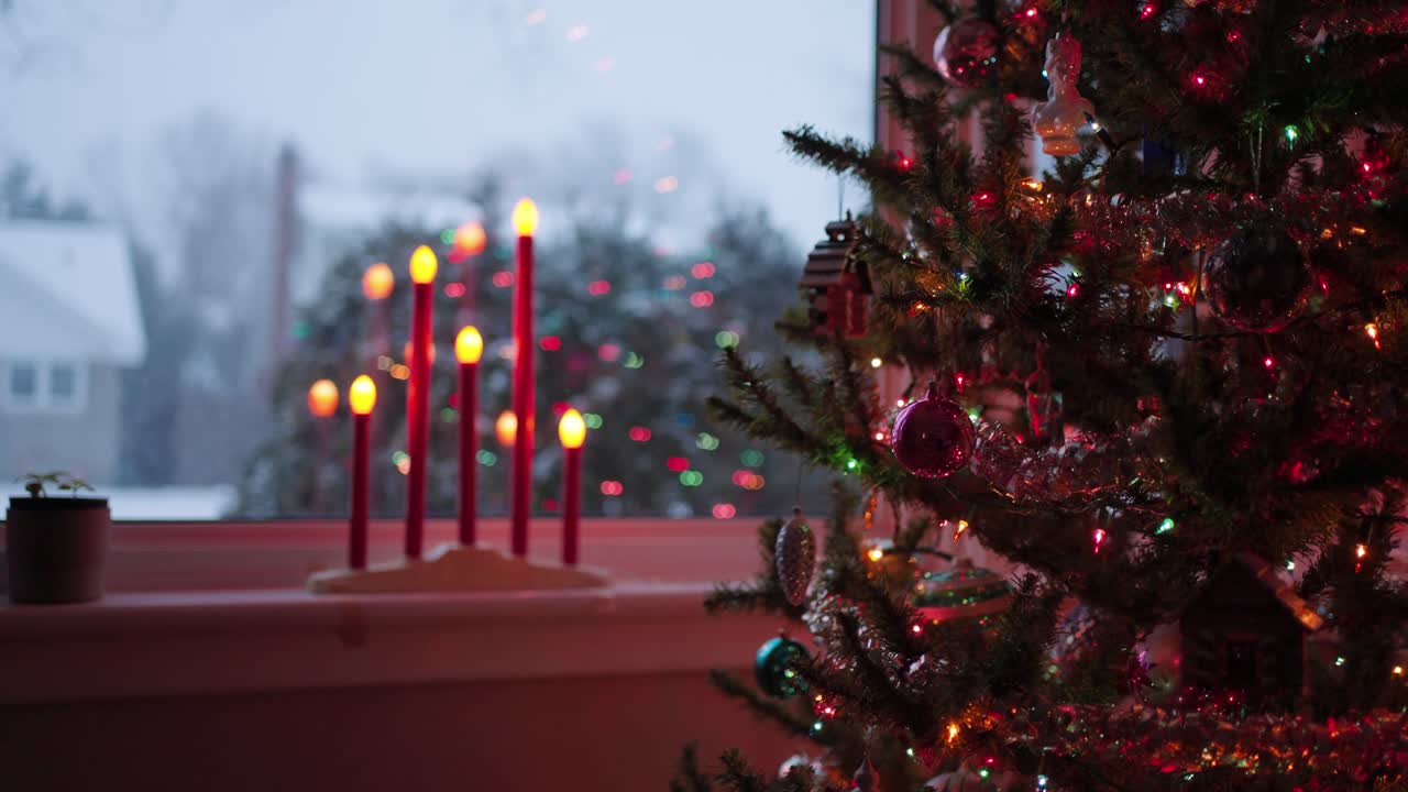 Snowy Christmas Tree and Candles on Christmas eve, slomo rack focus