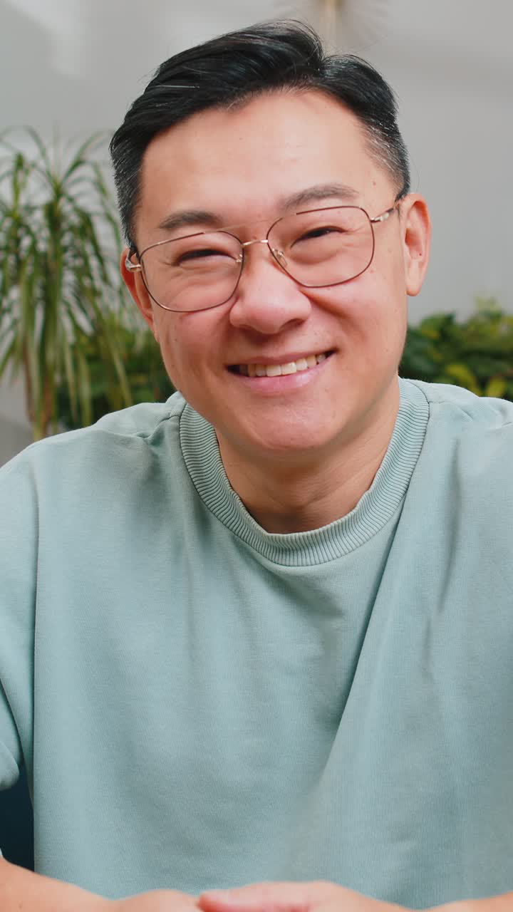 Happy asian man smiling friendly glad expression feel satisfied concept good news celebrate win