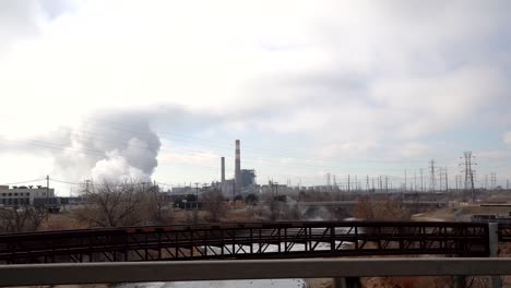 Slow-motion-POV-shot-of-emission-from-an-industrial-facility-in-Denver,-Colorado