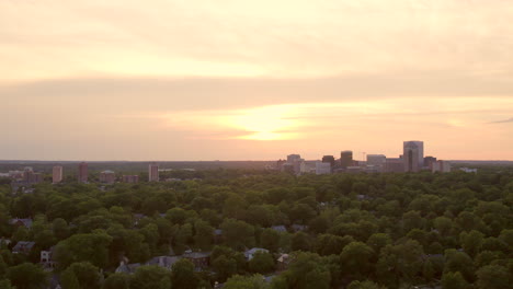 clayton skyline against beautiful sunset and over a nice neighborhood with a slow pan right