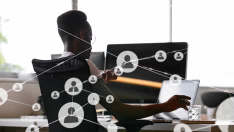 network of connections animation over person working on computer in office