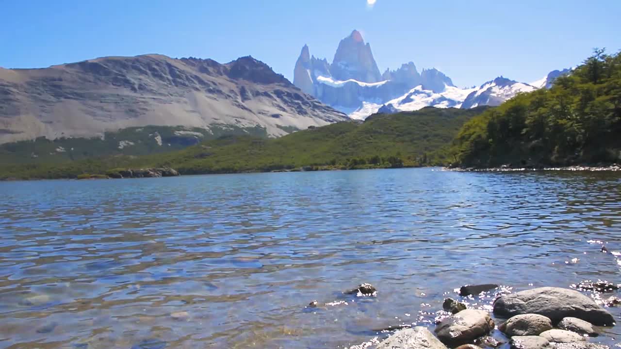 Fitz Roy and lake in Laguna Capri in Patagonia, Argentina. Trekking in Los Glaciares National Park near El Chalten. Trekking and adventure concept.