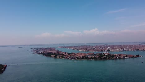 Cinematic-daytime-drone-view-of-romantic-Venice-islands,-a-sought-after-travel-destination,-highlighting-stunning-architecture