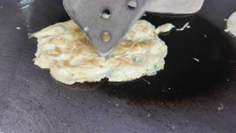 cooking an omelet on a griddle
