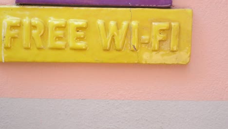 free wi-fi sign on a colorful wall