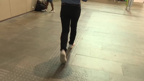 person walking in a hallway