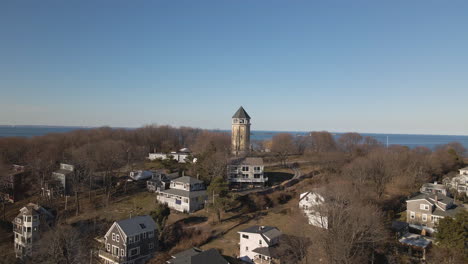 drone aerial footage of approach to a lookout tower, in hull ma, shows atlantic ocean beyond