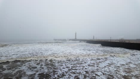 very mist and foggy scene on the coast of the uk