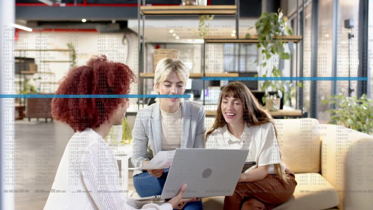 Three women working in office, typing and causing blue overlay, checking docs and laptop, agreeing