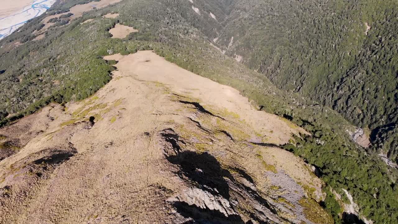 Athurs Pass aerial birds eye view shot. Craigieburn Forest Park in valley, Arthurs Pass. Stunning landscape of Southern Alps, New Zealand