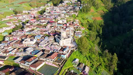 Mosque-on-the-middle-of-village-that-located-on-the-slope-of-Mount-Sumbing,-Indonesia---Baituttaqwa-mosque-on-Nepal-Van-Java,-Indonesia