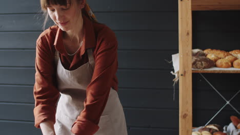 Beautiful-Female-Baker-Preparing-Dough