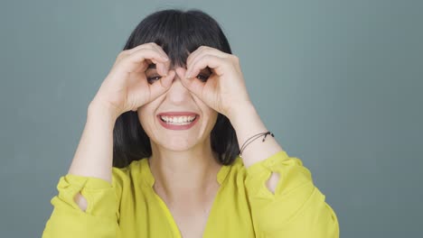 woman with binoculars looking away.