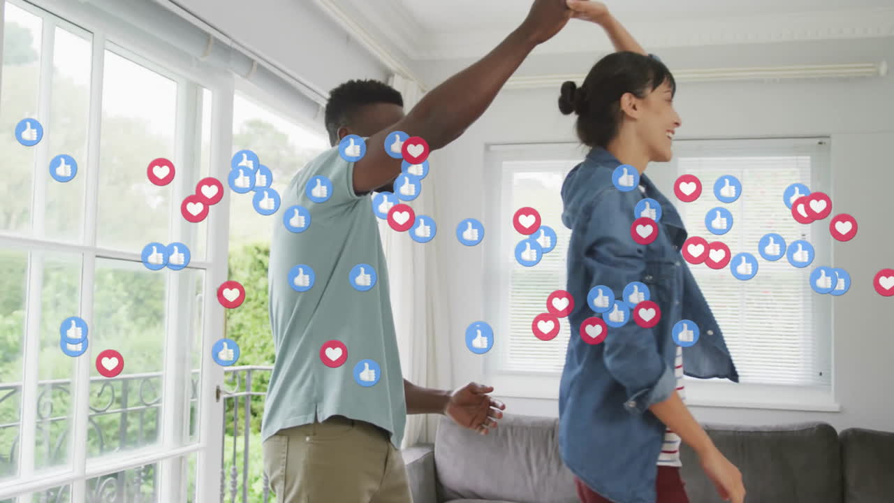 Couple dancing in modern lounge, featuring floating social media icons driving digital marketing