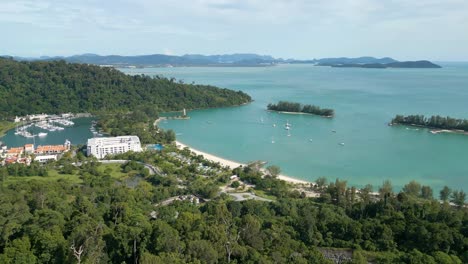 Aerial-view-of-Pantai-Kok-Beach,-Seratos-island,-and-Telaga-Harbour-Marina