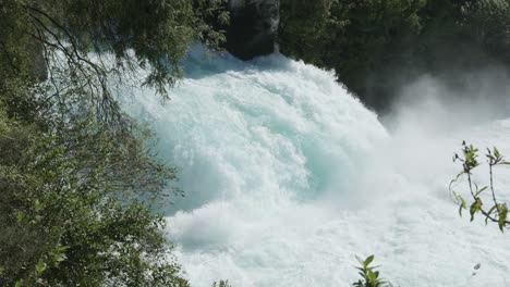 detail of huka falls waterfall on a sunny day in taupo, new zealand