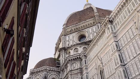 florence cathedral's dome seen from the street , tuscany, italy