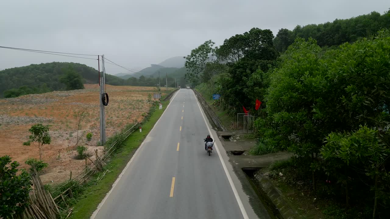 Rural Road with Motorcyclist