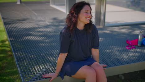 woman sitting on a metal platform