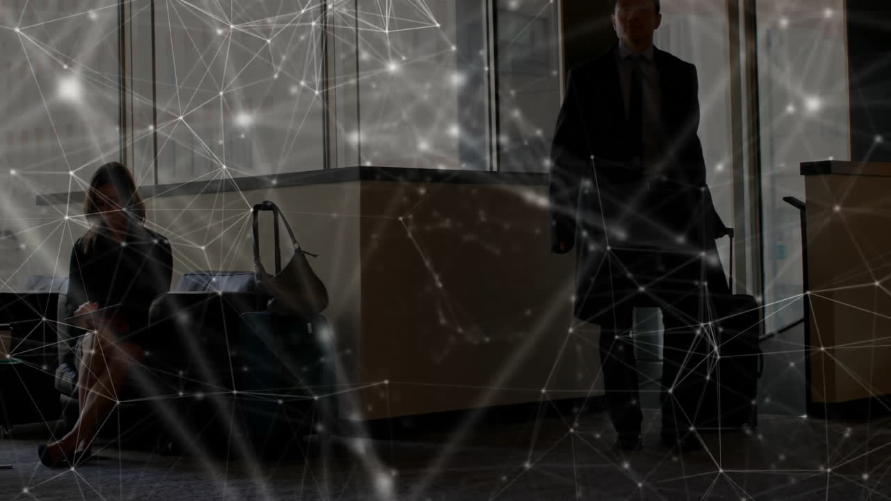 Man pulling suitcase, woman writing on tablet in airport terminal showing travel technology overlay