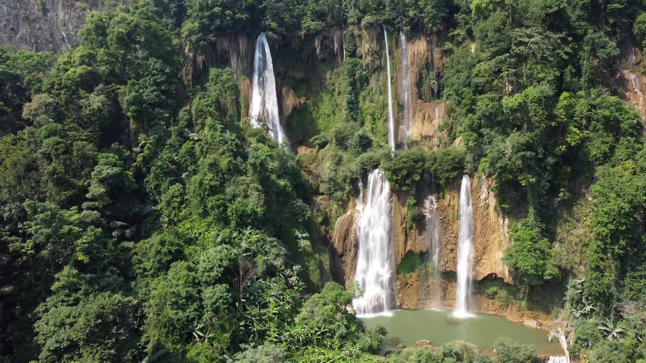 A nice 4K drone shot, rotating around Thi Lo Su Waterfall in the adventures jungle scenery of Umphang, located in the iconic backpacker country of Thailand in Southeast Asia