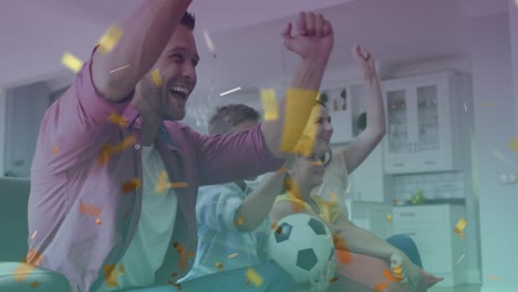 Animation-of-gold-confetti-over-parents,-son-and-daughter-watching-sports-celebrating-at-home