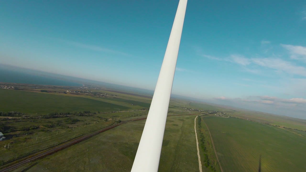 Aerial View of Wind Turbine and Rural Landscape