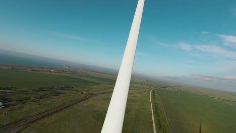aerial view of wind turbine and rural landscape