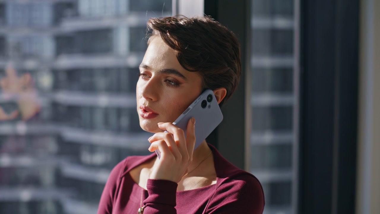 Pensive woman talking phone window office. Closeup business lady call city view.