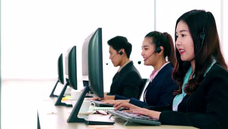 business people wearing headset working in office