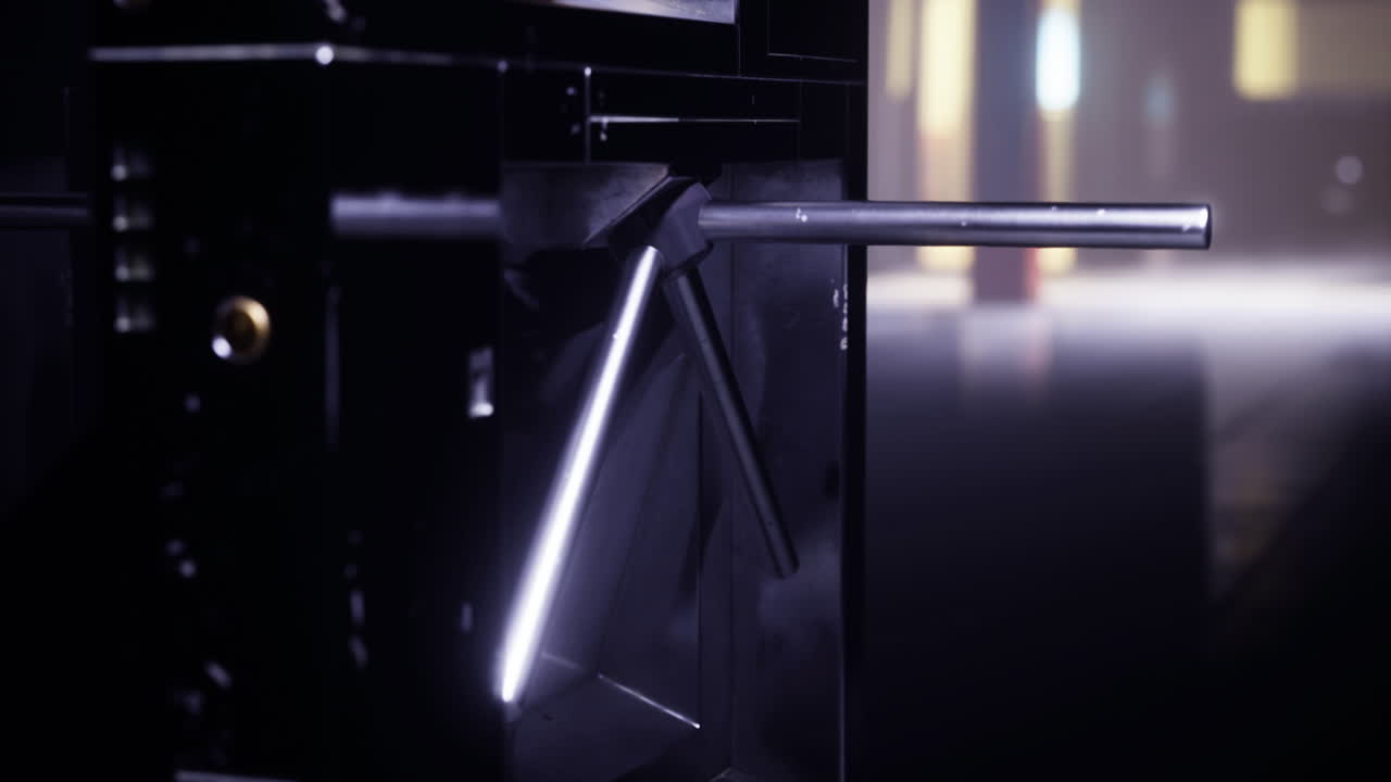 Modern turnstile at urban entryway in low light conditions