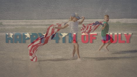 digital composite video of happy 4th of july text against kids running with u.s. flag on the beach