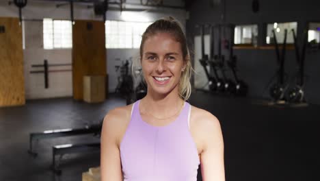 Portrait-athletic-Caucasian-woman-smiling-at-the-camera