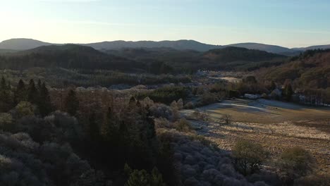 Landscape-Views-Across-Aberfoyle-Surroundings-with-Forests-During-a-Late-Afternoon-in-Scotland-from-an-Aerial-Panning-Shot