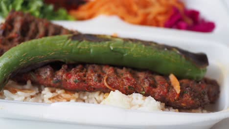 kebab, traditional turkish meat food with salad on a plate