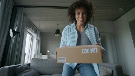 woman receiving package at home