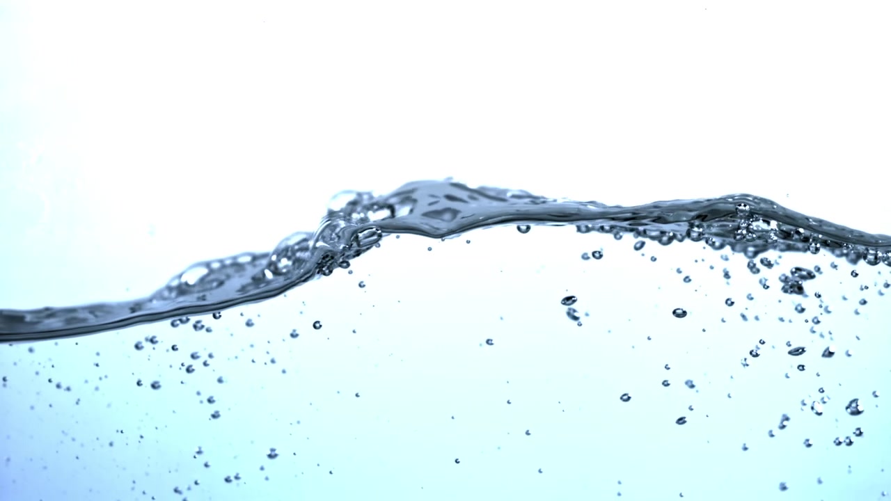 Clear water surface with bubbles and a gentle wave